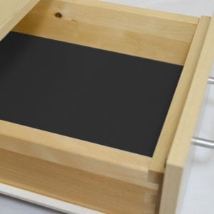 A wooden drawer with a MODERN LINE DESIGN and NON-SLIP ROLLS.