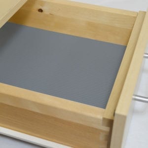 A drawer with modern line design and non-slip rolls.