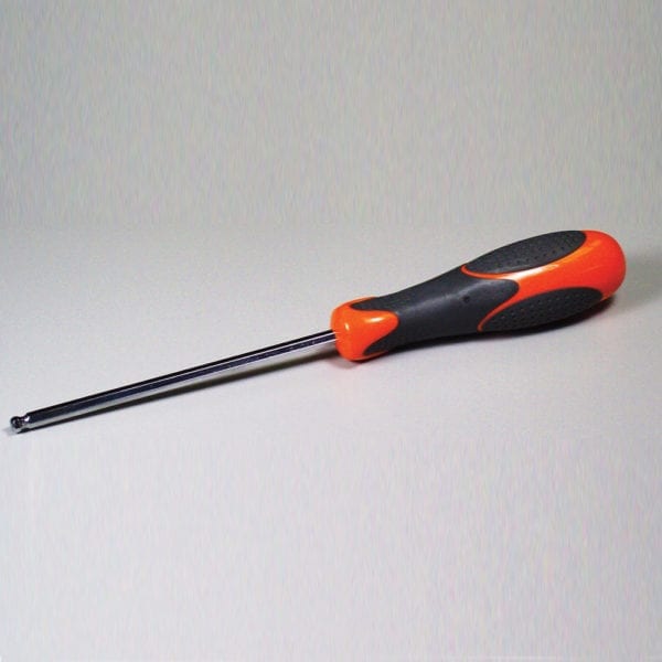 An orange and black drill bit on a white surface.