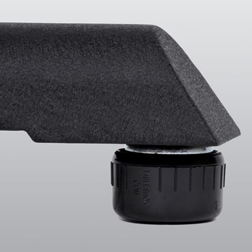 A black plastic holder with a black knob on it called TABLE SHOX improves stability.