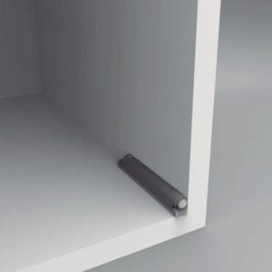 A white shelf with a black handle on it.