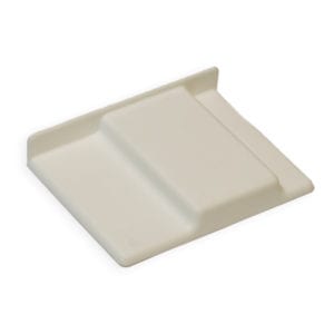 A white plastic tray on a white surface.