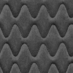 A close up image featuring a black quilted fabric design.
