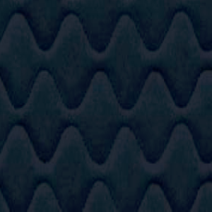 A close up image of a dark blue quilted fabric resembling meeting pods.