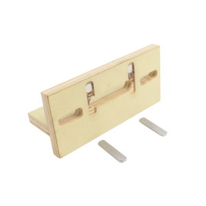 A wooden box with two screws and a piece of wood.