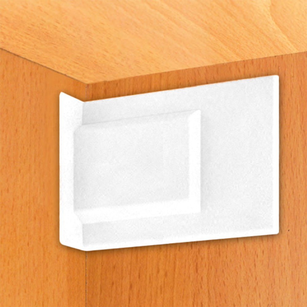 A white piece of paper on a wooden cabinet.