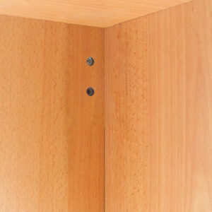 A close up of a wooden cabinet with screws.