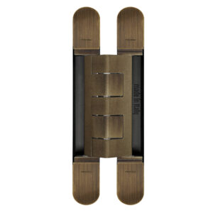 Concealed hinge in brass bronze finish on a white background.