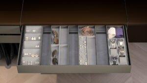 Open Closet drawer with grey organizer and luxury items